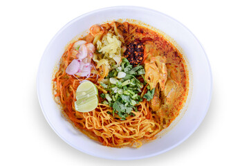 Thai spicy food, Egg noodle in chicken curry or name in thai is khao soi kai.noodles in soup cooked after the manner of the people of north Thailand on white background  with clipping path