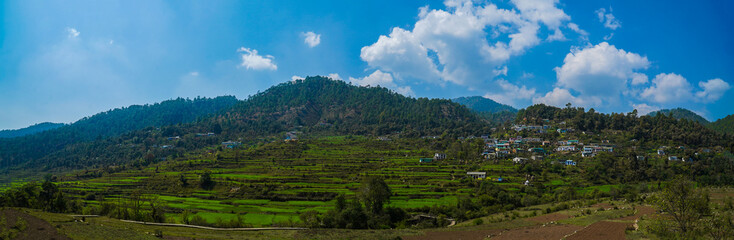 agricultural fields in the countryside of Kausani, Almora, mountain hills valley in Uttarakhand, Ranikhet. Nature Panoroma landscape background. © CLICK ON THE WAY