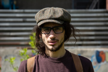 Attractive guy on the street with glasses.	