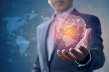 Business administrator holds a virtual globe in his hand in business administrative ability concept.