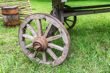 Old wooden cartwheel close-up. Rural vintage vehicle