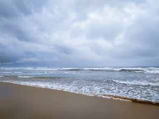 Wave of the sea on the Beautiful sand beach in India.