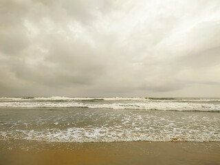Clouds over the beautiful waves on sea
