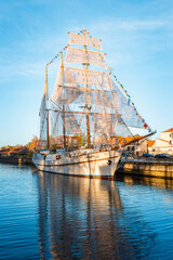 Beautiful old ship Meridian at sunset evening,blue calm sky,blue water.Symbol and landmark of...