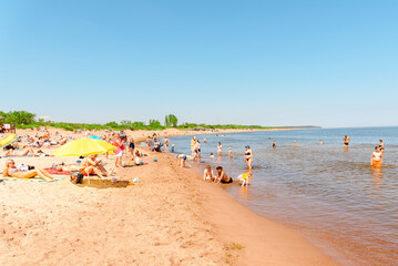 Fototapeta na wymiar Vacation tourists at the beach in summer hot bright summer day.Klaipeda Lithuania June 24 2022.