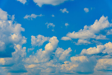 White fluffy clouds in the blue sky summer background.Cloudy white blue sky in the nice blue heaven sky.