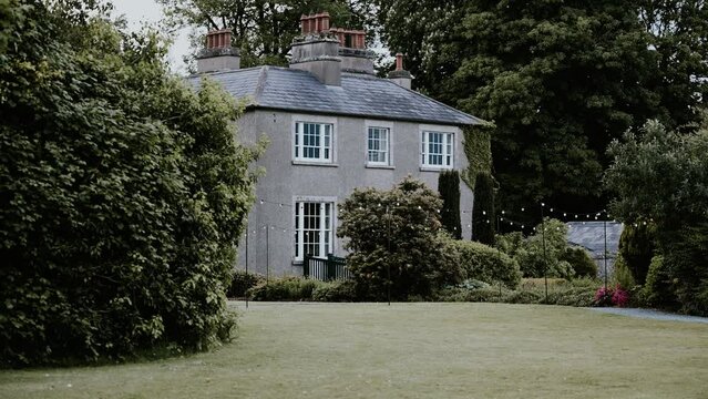 Static shot of Old Rectory Killyman surrounded by woodland