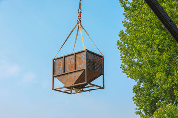 Fishermen use cranes to hoist carp in a fish pond, North China