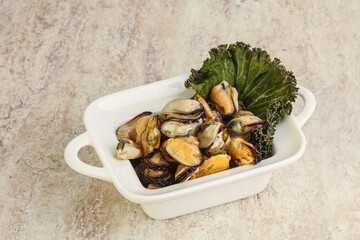 Tasty marinated mussels in the bowl