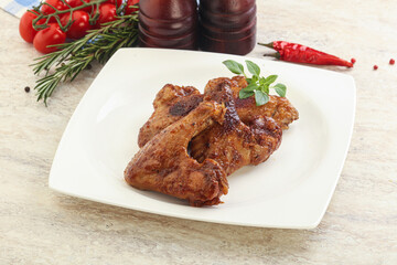 Roasted chicken wings with spicy sauce