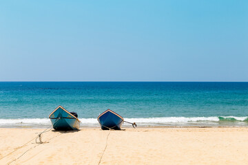 Fishing boat on tropical beach, summer outdoor day light