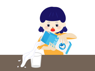 牛乳をコップに注ごうとしてこぼす子ども