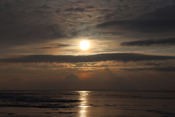 sunset over floating ice floes