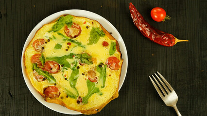 omelet with tomatoes and herbs fried eggs delicious healthy breakfast in rustic style