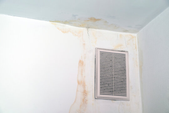 Leakage On The Ceiling In An Apartment Or House. Ventilation Grill. Upstairs Neighbors Flooded. Roof Repair Needed