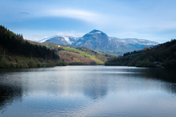 Obraz na płótnie Canvas Ibiur reservoir with Txindoki mountain as background, Basque Country in Spain