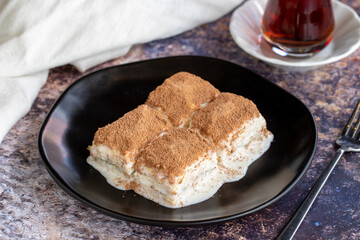 Cold baklava. Baklava with milk on a colored background. Turkish cuisine delicacies. close up
