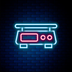 Glowing neon line Electronic scales icon isolated on brick wall background. Weight measure equipment. Colorful outline concept. Vector - obrazy, fototapety, plakaty