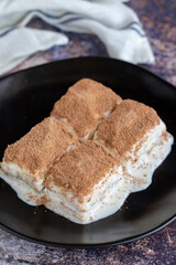 Cold baklava. Baklava with milk on a colored background. Turkish cuisine delicacies. close up