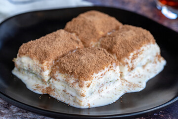 Cold baklava. Baklava with milk on a colored background. Turkish cuisine delicacies. close up