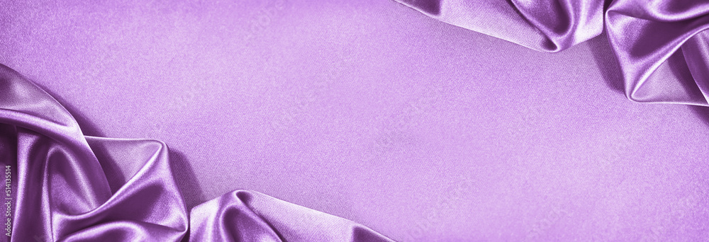 Wall mural beautiful purple pink silk satin background. soft folds. shiny fabric. luxury lilac background. spac