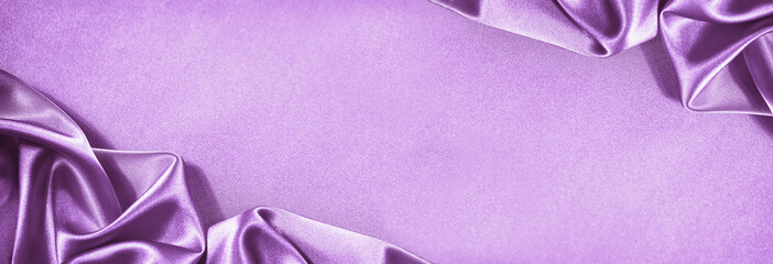 Beautiful purple pink silk satin background. Soft folds. Shiny fabric. Luxury lilac background....