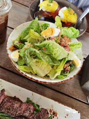 Grilled beef steak with fresh vegetable salad on the plate. healthy food.