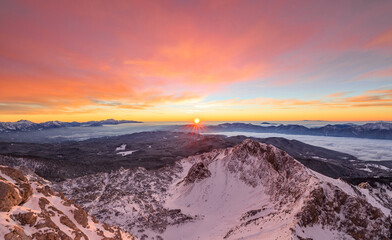Vivid sunrise in the mountains. A red morning in the Julian Alps.