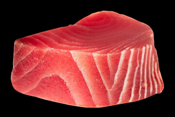 Yellow fin tuna steak isolated on black background. Fresh rare tuna steak isolated. Raw yellowfin...
