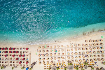 Aerial top down view to the emerald sea of the popular beach Akti Iliou, Alimos, Athens, Greece, during summer time