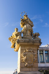 Fototapeta na wymiar Statue of St. John of Nepomuk on the Main Square in Poznan, Poland
