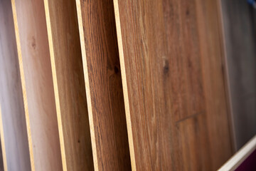 Naklejka na ściany i meble Wood laminate floor. Sample of laminate and vinyl tile on oak wooden background