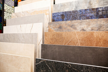 Several types of marble flooring in the window of a construction store