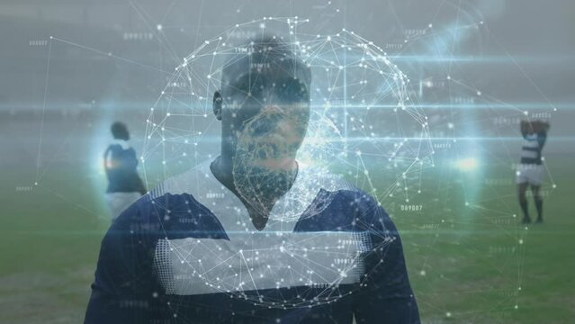 Animation of globe of connections over african american rugby player at stadium