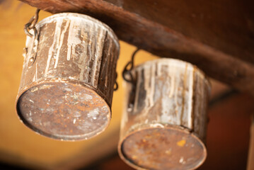 Enkhuizen, Netherlands. June 2022. Close up of old paint cans on the ceiling of a paint store.