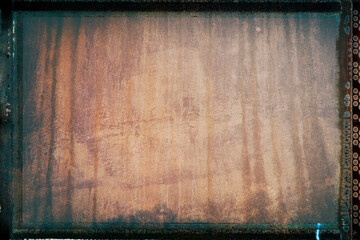 Artistic vintage photo with film strip frame and  grain – Rusty metal plate for background...