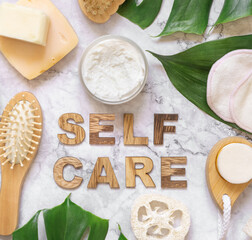 Self Care text near cosmetics, skincare accessories and monstera leaves, mockup