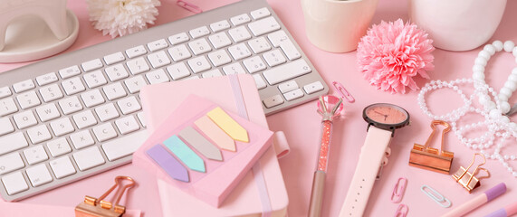 Keyboard and Pink school girly accessories on pastel pink close up
