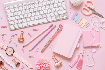 Fototapeta na wymiar Notebook, Pink school girly accessories and keyboard on pastel pink Top view, mockup