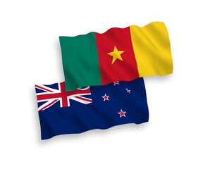 National vector fabric wave flags of New Zealand and Cameroon isolated on white background. 1 to 2 proportion.