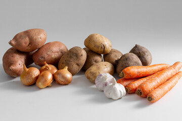 food and culinary concept - close up of different raw vegetables on table