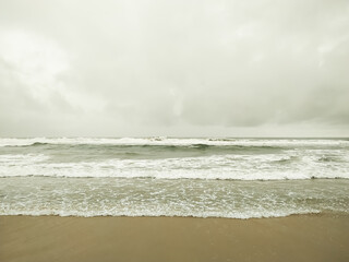 Bubbles white waves on the beach texture background