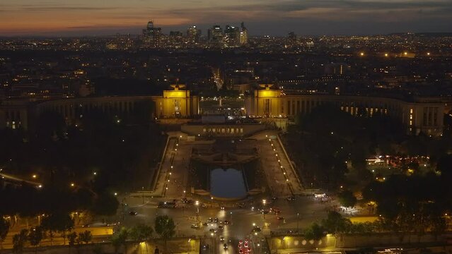 Trocadero esplanade and La Defense district seen from the Eiffel Tower at night in Paris, France