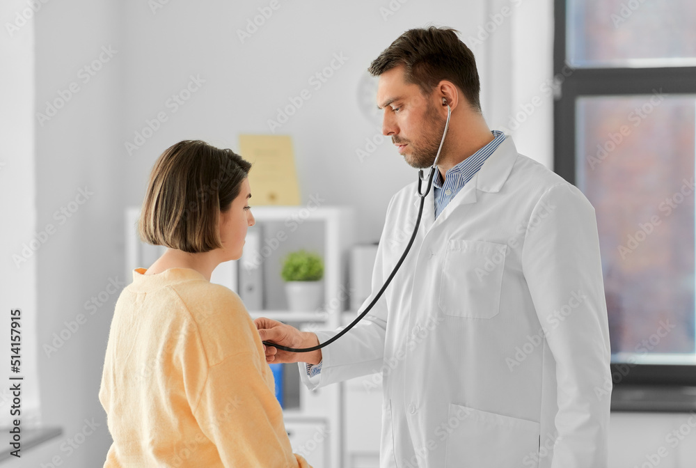 Canvas Prints medicine, healthcare and people concept - male doctor with stethoscope and woman patient at hospital