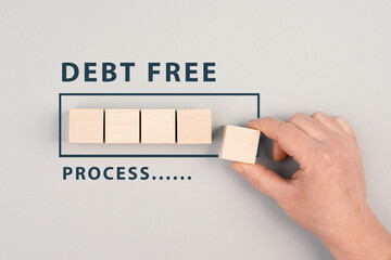 The words debt free in process are standing next to the loading bar, ending credit payments and...