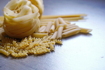 Almaty, Kazakhstan - 03.30.2022 : Pasta of various types are laid out on the kitchen table