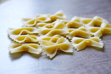 Almaty, Kazakhstan - 03.30.2022 : Dry pasta is laid out on the kitchen table.
