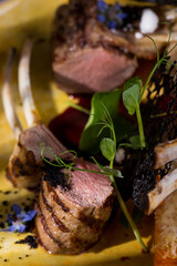 Grilled rack of lamb with carrot pie.