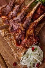 Rack of lamb medium rare with a glass of rosé wine