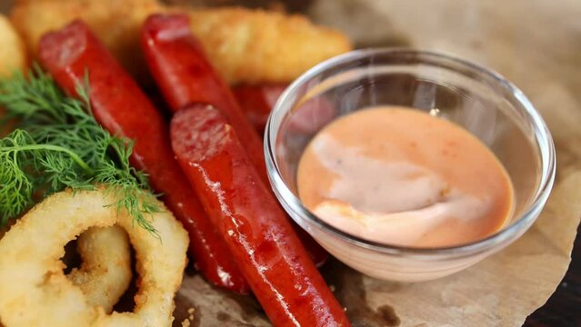 beer snack. sausage dipped in sauce